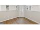 The room showcases luxury vinyl plank flooring and views of the exterior of the home at 30 Stonewall Dr, Covington, GA 30016