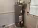Practical utility room with a water heater and access to an exterior door at 1028 Dixie Dr, Jonesboro, GA 30236