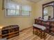 Bedroom features a window with natural light and an antique wood dresser with a bench at 357 Oak Hill Rd, Covington, GA 30016