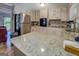 Well-lit kitchen with granite countertops, stainless steel appliances, and ample cabinet space at 357 Oak Hill Rd, Covington, GA 30016