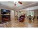 Inviting living space with modern wood-look flooring, a dining area, and seamless flow to the kitchen at 357 Oak Hill Rd, Covington, GA 30016