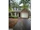 Charming two-story home with neutral siding, brick accents, and a two-car garage at 4752 Browns Mill Ferry, Lithonia, GA 30038