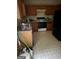 Kitchen with matching wooden cabinets, an oven, and white tile flooring at 4752 Browns Mill Ferry, Lithonia, GA 30038