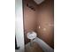 Compact powder room with a pedestal sink, light fixture, and towel rack at 4752 Browns Mill Ferry, Lithonia, GA 30038