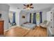 Cozy bedroom with ceiling fan, pitched ceiling, and light gray walls at 74 Price W Dr, Locust Grove, GA 30248