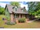 Charming brick home with inviting front porch and lush landscaping at 74 Price W Dr, Locust Grove, GA 30248
