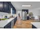Kitchen features sleek appliances, ample counter space, and modern cabinetry at 74 Price W Dr, Locust Grove, GA 30248