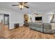 Inviting living room featuring a cozy brick fireplace and hardwood floors at 74 Price W Dr, Locust Grove, GA 30248
