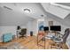 Bright home office space features light gray walls, wood floors and skylights for natural lighting at 74 Price W Dr, Locust Grove, GA 30248