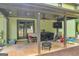 Covered back patio with a ceiling fan, outdoor furniture, and string lights at 74 Price W Dr, Locust Grove, GA 30248