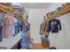 Walk-in closet with clothing racks, shelves, and storage containers at 74 Price W Dr, Locust Grove, GA 30248