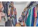 Walk-in closet provides ample storage space for clothes, shoes, and accessories at 74 Price W Dr, Locust Grove, GA 30248