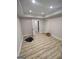 A finished basement with recessed lighting, a door to the hallway, and wood look flooring at 312 Archway Ln, Peachtree City, GA 30269