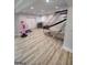 Basement space with gym equipment and basketball game, recessed lighting, and wood look flooring at 312 Archway Ln, Peachtree City, GA 30269
