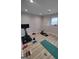Finished basement featuring exercise equipment, recessed lighting, and wood look flooring at 312 Archway Ln, Peachtree City, GA 30269