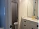 Clean bathroom with a neutral-toned vanity, granite countertops, and a shower with a gray curtain at 312 Archway Ln, Peachtree City, GA 30269