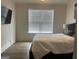Comfortable bedroom with a large window and modern decor, creating a relaxing atmosphere at 312 Archway Ln, Peachtree City, GA 30269