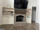 Living room fireplace and mantle with built-in shelving and wood floors at 312 Archway Ln, Peachtree City, GA 30269