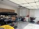 Spacious garage with ample storage, including cabinets, a golf cart and plenty of open floor space at 312 Archway Ln, Peachtree City, GA 30269