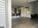 Bright, open kitchen features a bar area, stainless appliances, and hardwood floors leading to the living room at 312 Archway Ln, Peachtree City, GA 30269