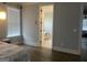 Relaxing main bedroom with an open doorway leading to a bright, tiled bathroom at 312 Archway Ln, Peachtree City, GA 30269