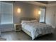 Serene main bedroom with modern lighting, a decorative side table, and hardwood floors at 312 Archway Ln, Peachtree City, GA 30269
