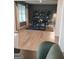 A view of the dining room from the entryway that includes hardwood flooring and decorative shelving at 613 Elsa Lane # 77, Mcdonough, GA 30252