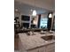 Open-concept living and dining area with a view of the kitchen island at 613 Elsa Lane # 77, Mcdonough, GA 30252