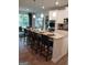 Modern kitchen with a large island, white cabinets, and stainless steel appliances at 613 Elsa Lane # 77, Mcdonough, GA 30252