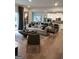 Open-concept living room flowing into a modern kitchen at 613 Elsa Lane # 77, Mcdonough, GA 30252