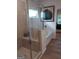 Modern tiled shower and soaking tub with seating and glass door at 613 Elsa Lane # 77, Mcdonough, GA 30252