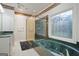 Bathroom with separate shower and tub featuring green marble accents, along with classic fixtures at 885 Kelleytown Rd, Mcdonough, GA 30252