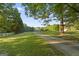 Long driveway leading to this beautiful home nestled amongst mature trees and lush greenery at 885 Kelleytown Rd, Mcdonough, GA 30252