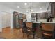 Kitchen with wooden cabinets, stainless steel appliances, granite countertops, and breakfast bar seating at 885 Kelleytown Rd, Mcdonough, GA 30252
