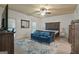 Main bedroom suite featuring a sitting area and a king-size bed at 885 Kelleytown Rd, Mcdonough, GA 30252