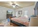 Comfortable main bedroom with a king-sized bed and nice decor at 885 Kelleytown Rd, Mcdonough, GA 30252