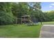 Backyard playground featuring a swing set, playhouse, and trampoline, perfect for Gathering fun at 885 Kelleytown Rd, Mcdonough, GA 30252
