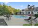 Backyard with a sparkling pool, lounge chairs, and lush landscaping creating a serene retreat at 885 Kelleytown Rd, Mcdonough, GA 30252