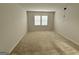 Spacious bedroom with neutral walls, carpet, and a window with blinds at 2051 Blue Sky Ave, Covington, GA 30016