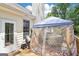 Enclosed back deck area with comfortable seating, ideal for outdoor entertaining at 1010 Capella Creek Way, Grayson, GA 30017