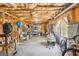 Spacious unfinished basement with exposed beams, concrete floor, and abundant storage solutions at 1010 Capella Creek Way, Grayson, GA 30017