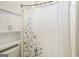 Bathroom featuring a shower with curtain and storage space at 1010 Capella Creek Way, Grayson, GA 30017