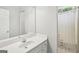 Bathroom featuring a single sink vanity, a mirror and a shower with curtain at 1010 Capella Creek Way, Grayson, GA 30017