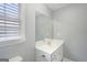 Bright bathroom featuring a large vanity, expansive mirror, and modern fixtures for a clean, updated look at 1010 Capella Creek Way, Grayson, GA 30017