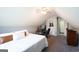 Comfortable bedroom featuring a plush carpet, bed, desk and ample space at 1010 Capella Creek Way, Grayson, GA 30017