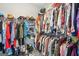 Walk-in closet with shelving and hanging rods for ample storage space at 1010 Capella Creek Way, Grayson, GA 30017