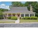Exterior view of the clubhouse, surrounded by manicured landscaping at 1010 Capella Creek Way, Grayson, GA 30017