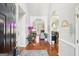 The home's entry foyer features hardwood floors and architectural details at 1010 Capella Creek Way, Grayson, GA 30017