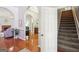 Hallway view showing access to living room, dining room and staircase at 1010 Capella Creek Way, Grayson, GA 30017