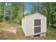 Well-maintained backyard storage shed with a solid door and concrete block foundation at 1010 Capella Creek Way, Grayson, GA 30017
